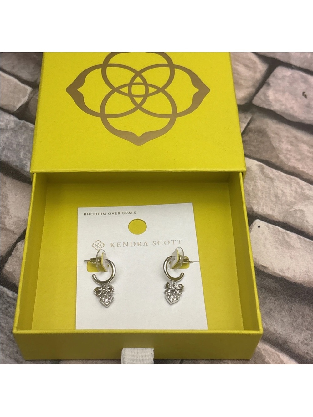 New Kendra Scott Anna huggie Bow earring set features a silver-toned